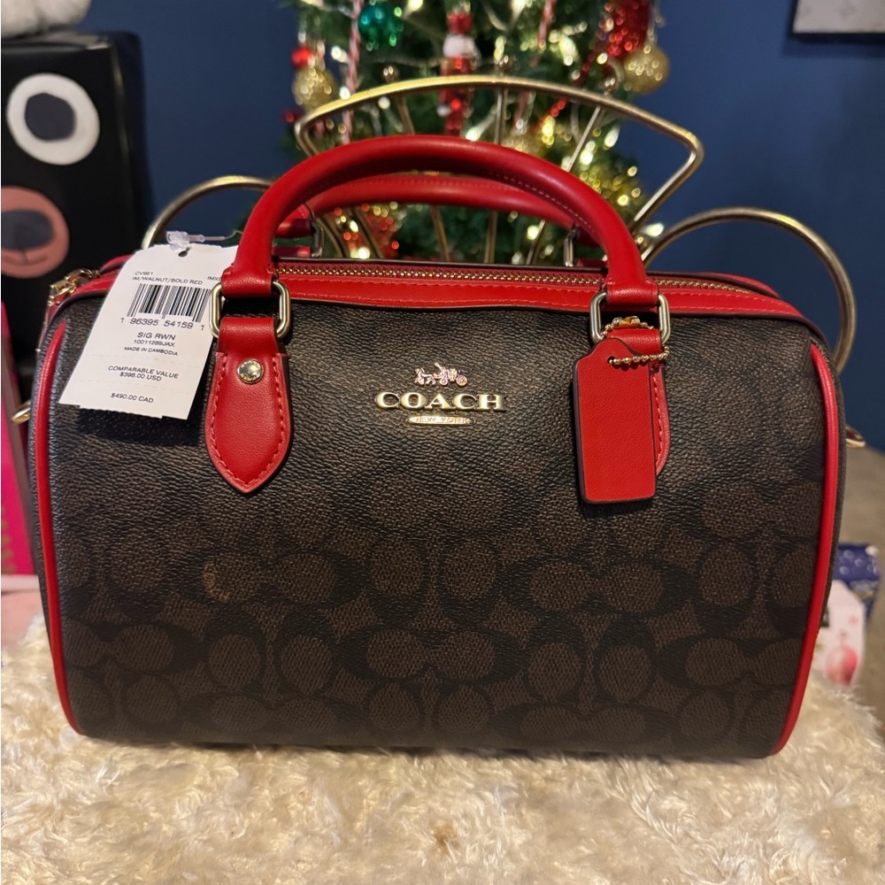 Coach Boston bag with detachable Crossbody strap.